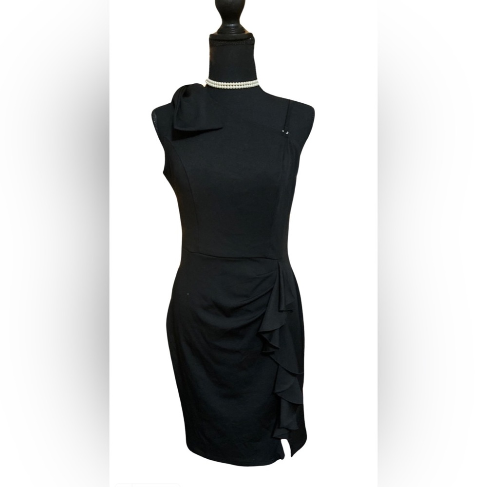 Belle Pogue black one shoulder dress with ruffle.
